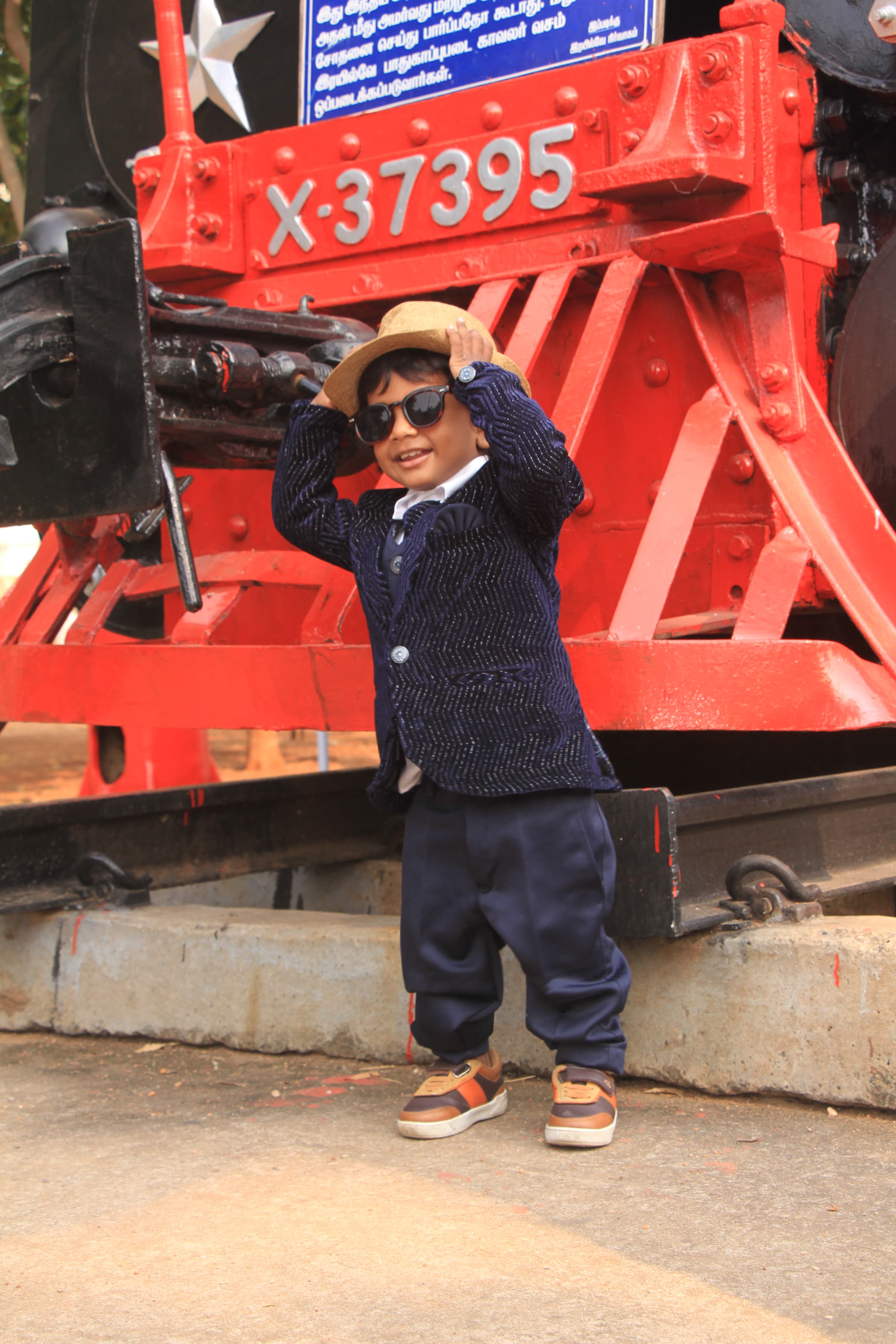 Baby surrounded by plush toys during a photoshoot